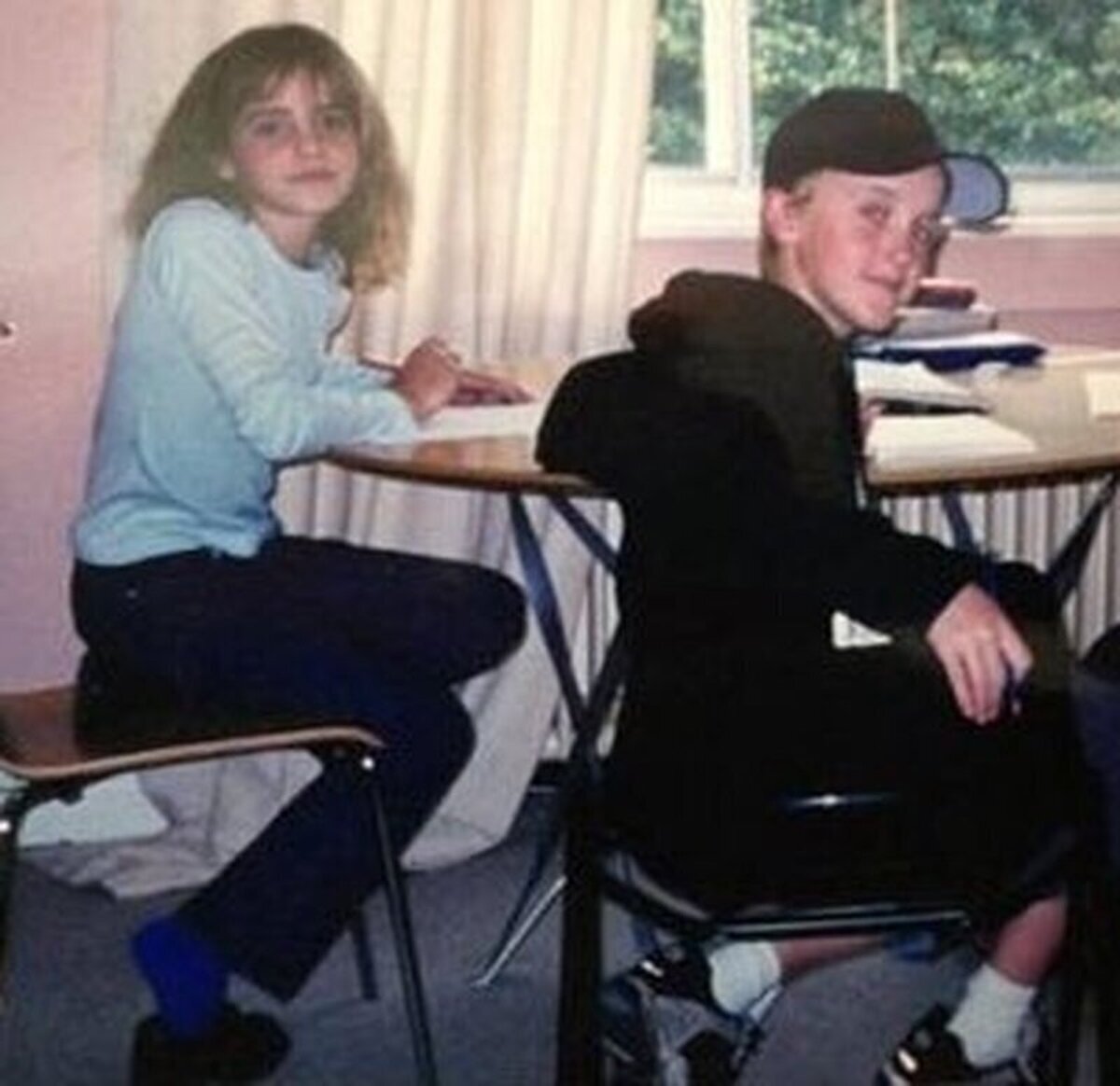 Emma Watson (Hermione) y Tom Felton (Draco) en el primer día de rodaje de la saga Harry Potter.  
